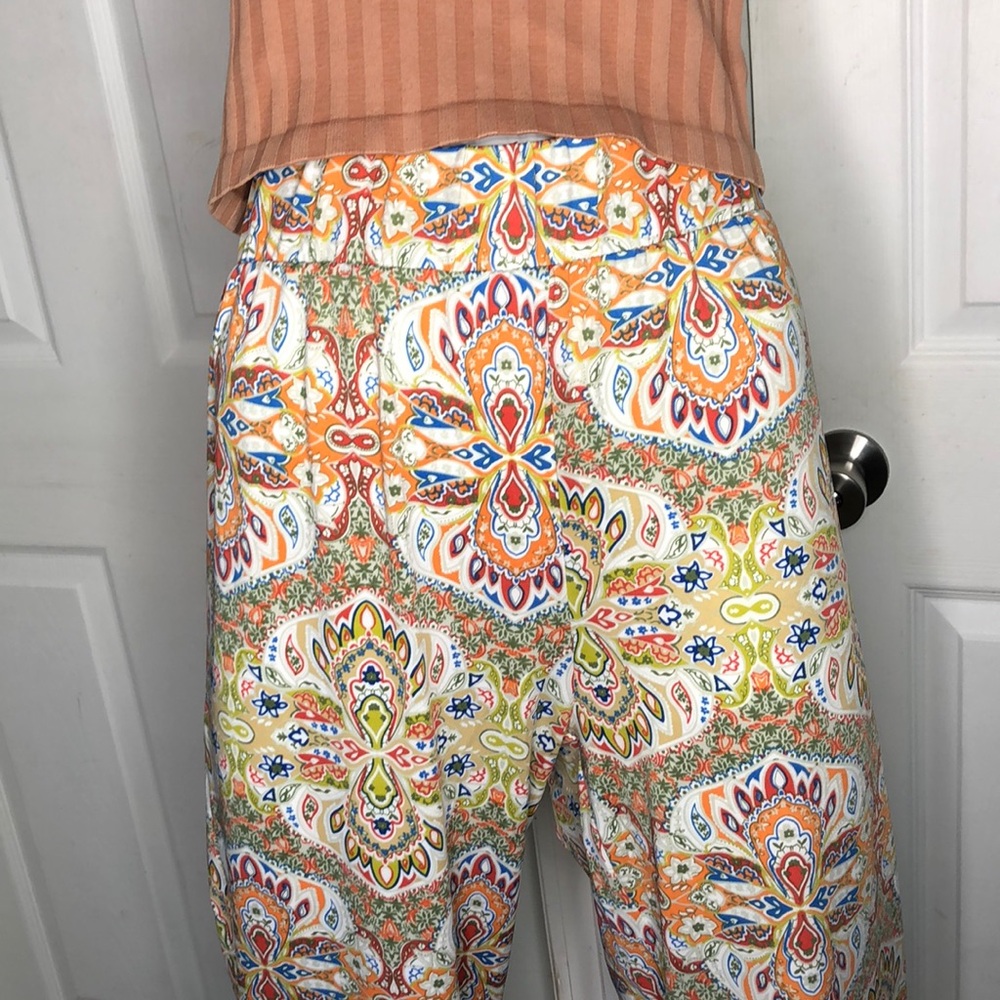 Sunny Leigh NWT Women’s Knit Print Pants color India Orange size Lg